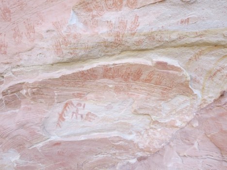 I fantasized that women were grinding the corn, and when their hands got too muddy with red clay, here they went to clean them off.  Many handprints also had the familiar spiral inside