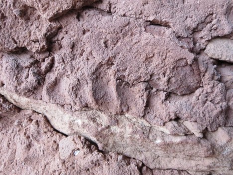 Fingerprints are common to be seen on the plaster and mortar work.  If this doesn't connect you with the people who did this work, nothing will.