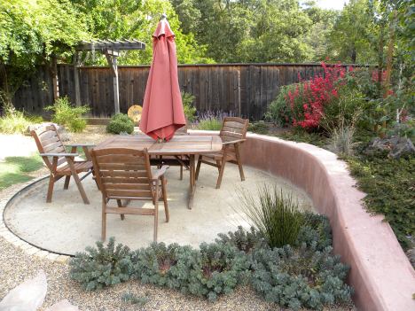 Decomposed Granite sunken patio edged with stone and Ryerson's header.